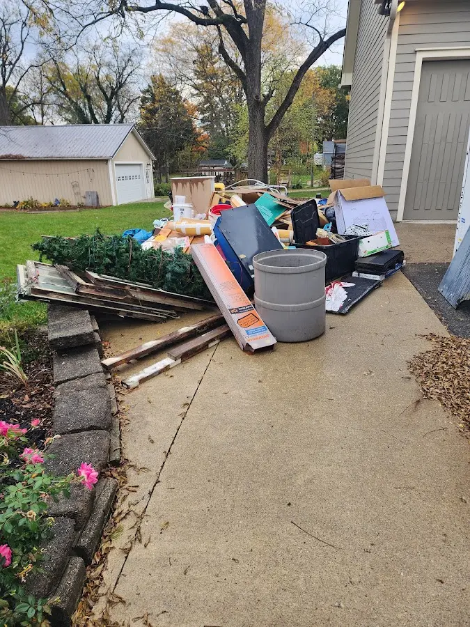 Dumpster being loaded with debris for Estate Cleanout Dumpster Rental in McSherrystown